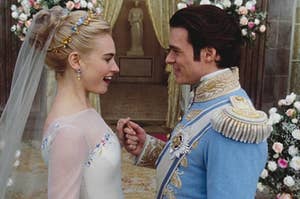 Cinderella and Prince Charming from the live-action Cinderella standing at the altar at their wedding surrounded by beautiful flowers