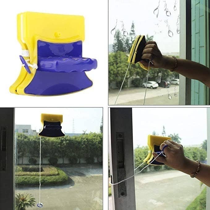 Magnetic glass cleaner attached to a window demonstrating how the cleaning is done.