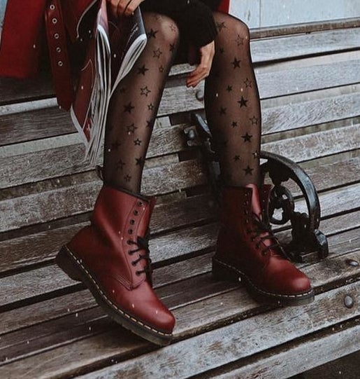 model wearing the red boots with black laces