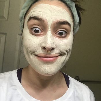 writer with a stiff smile in the hard, dried clay mask