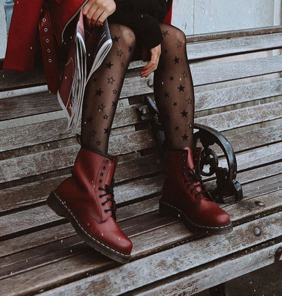 model wearing red boots with black laces