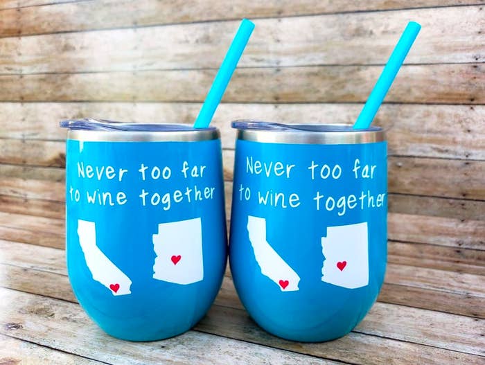 Blue wine tumblers with blue straws that say &quot;never too far to wine together&quot; with California and Arizona states