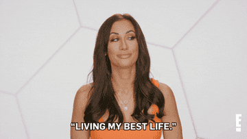A GIF of a person saying living my best life