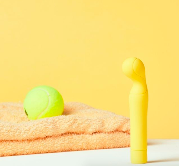 Bright yellow dildo with tennis ball inspired head 