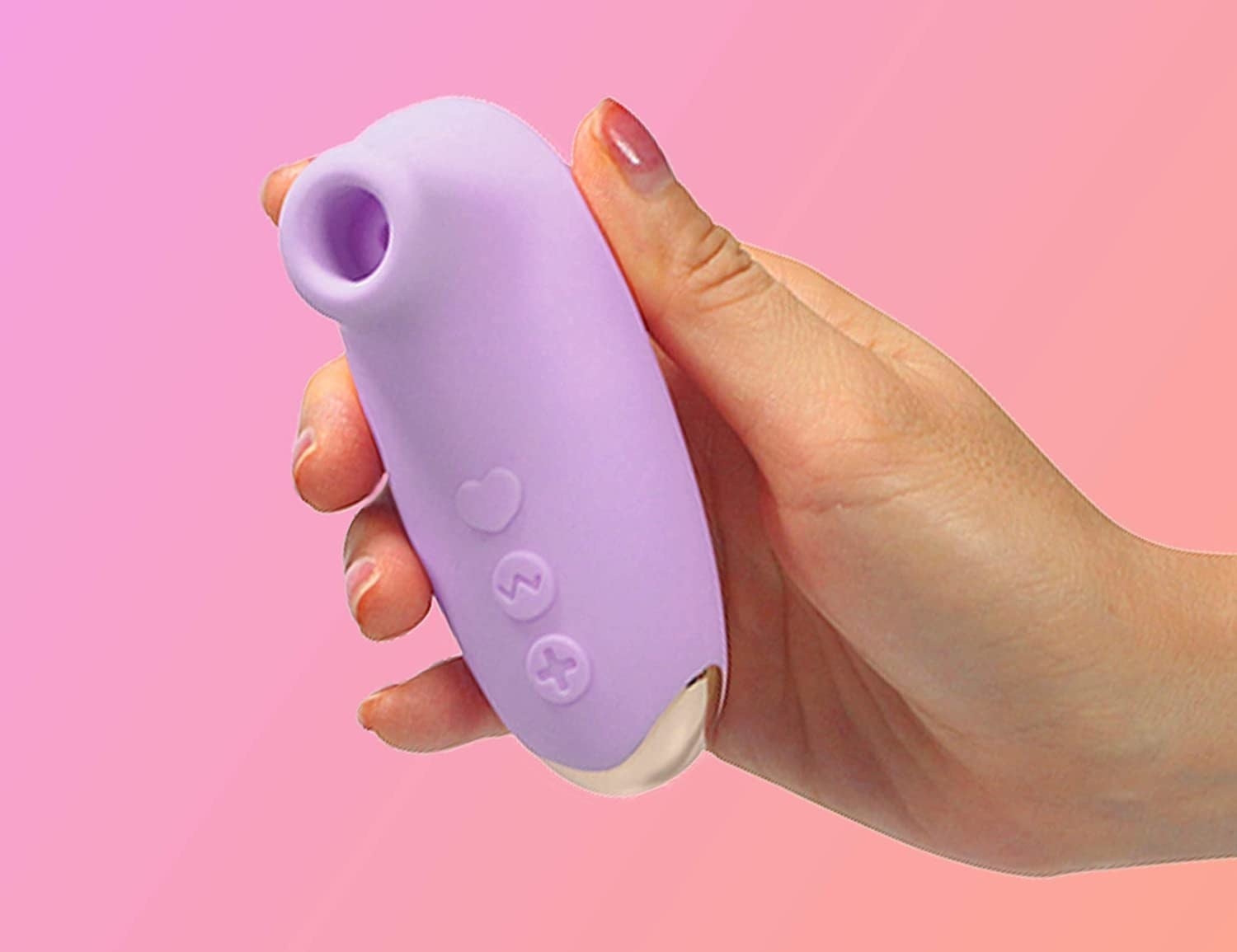 Palm-sized vibe with silicone around exterior and small silicone lip over suction hole 