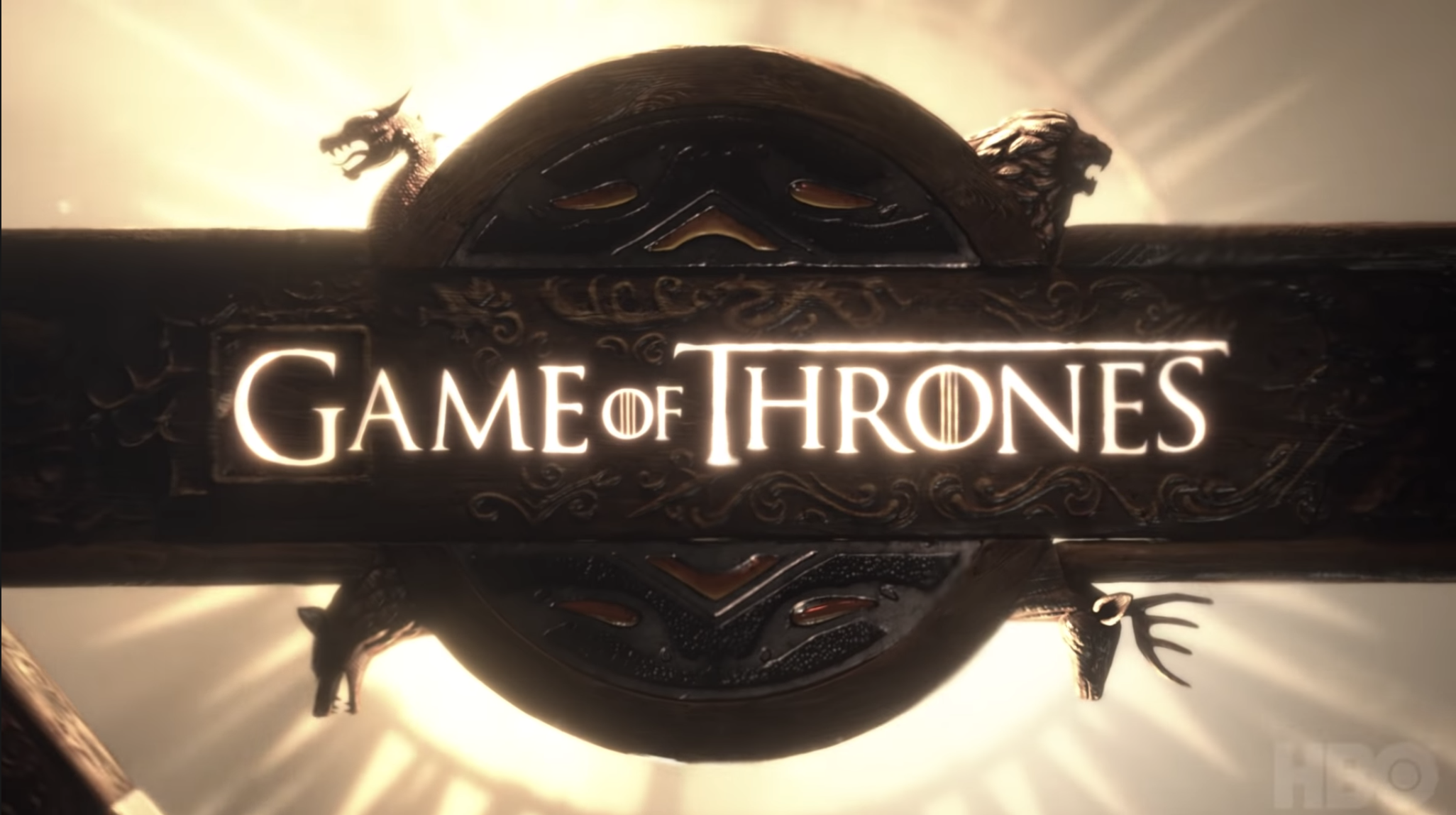 &quot;GoT&quot; title card — which is the title of the show branded into an iron circle. 