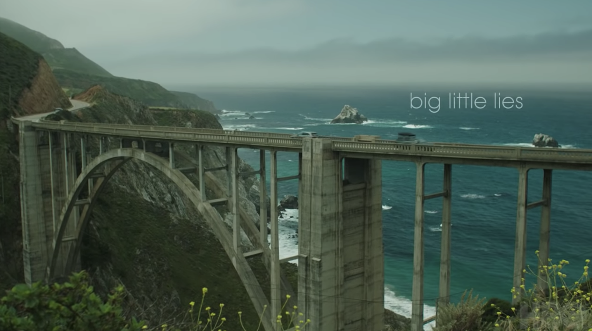 &quot;Big Little Lies&quot; title card — which is the title of the show over a bridge in Monterey, CA. 