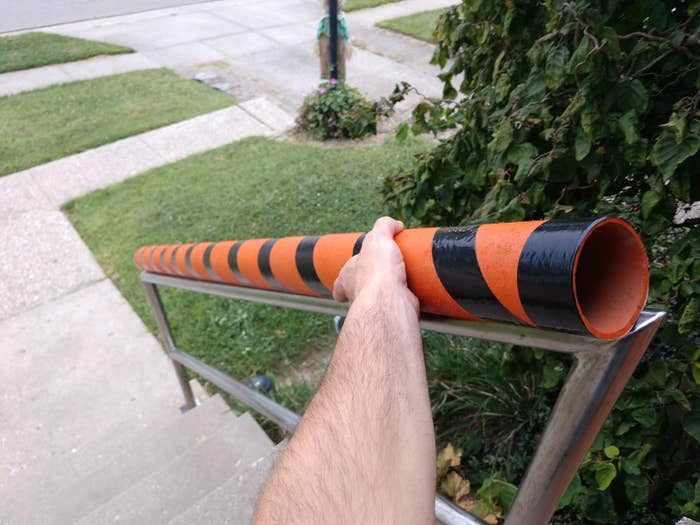 Halloween chute lies along a porch railing to deliver candy