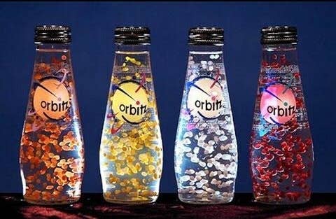 A shot of four Orbitz bottles on a table