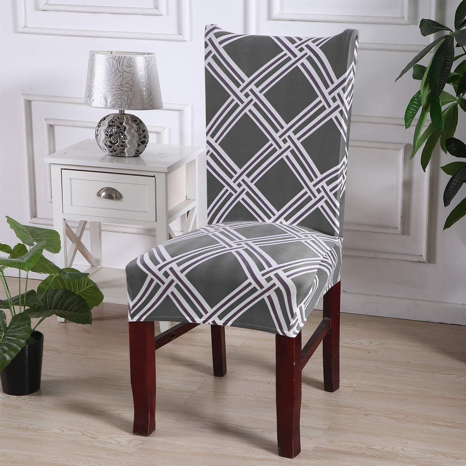 A chair with a patterned slipcover over it