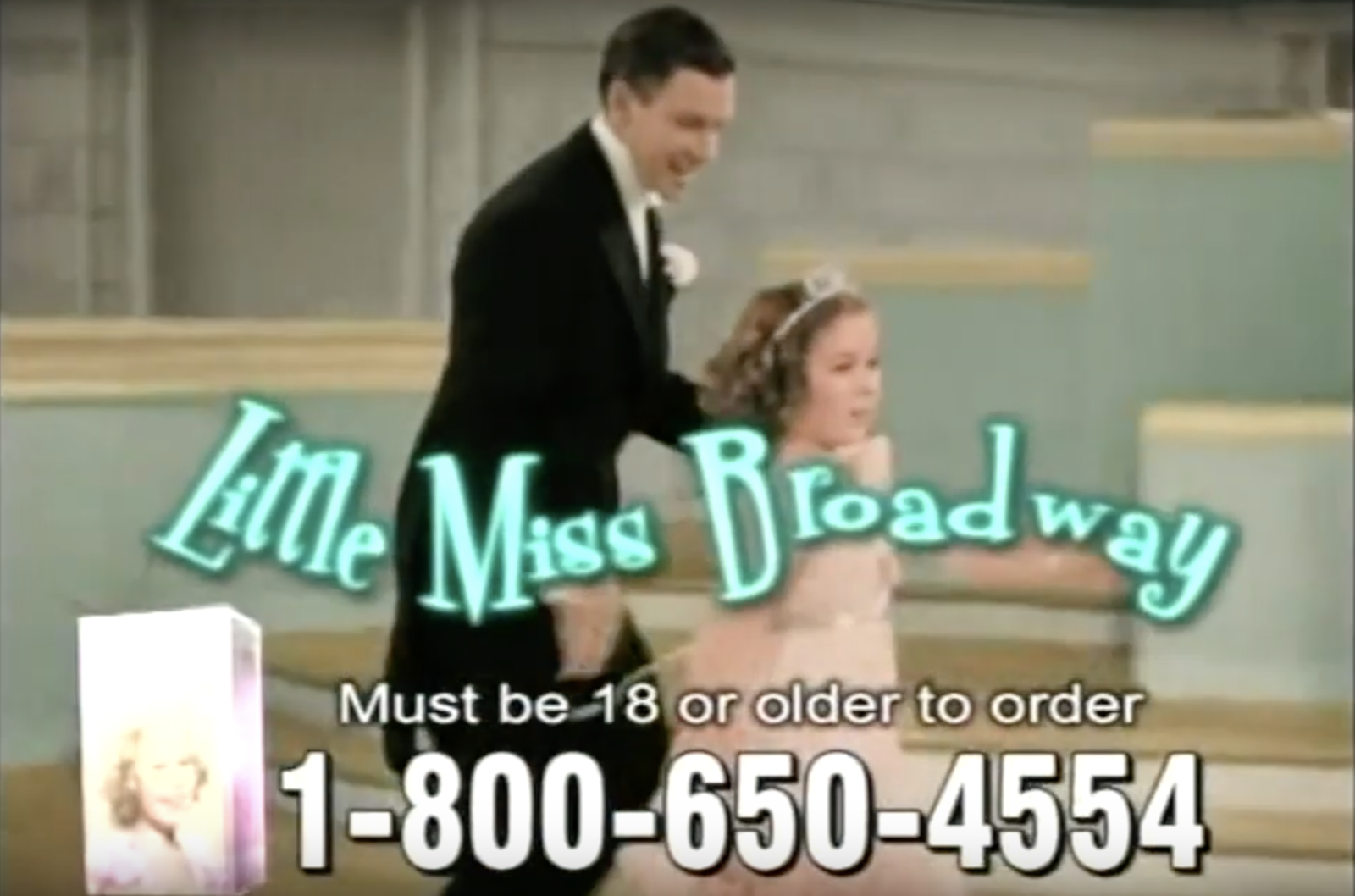 A screen grab of the commercial with Shirley Temple holding a dancer&#x27;s hand and &quot;Little Miss Broadway&quot; written over her