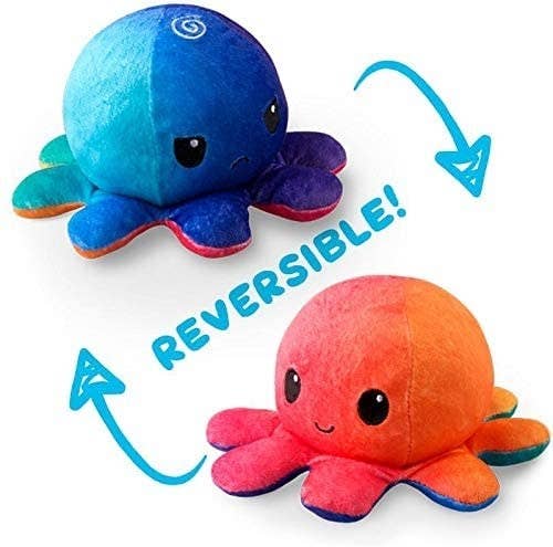 Octopus plush that is orange and smiley on one side and blue and frowny on the other