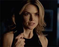 Barbara holding up a knife