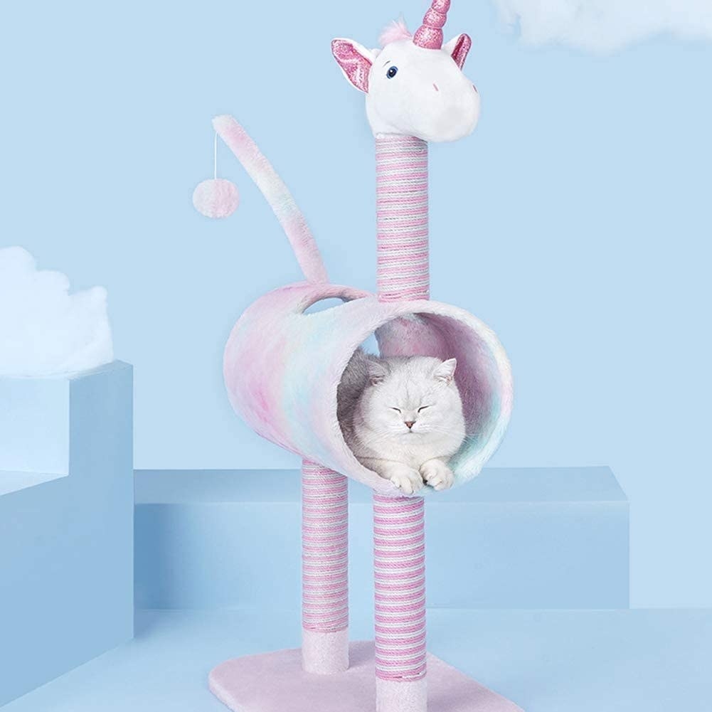 The unicorn-shaped cat condo, with a pink base and two pink &quot;legs,&quot; a multi-colored fur tube, a &quot;tail&quot; with ball and string dangling from it, and a &quot;head&quot; with unicorn horn