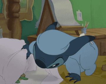 Stitch from Lilo and Stitch grabbing a stuffed animal and putting himself to bed 