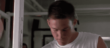 A GIF of Channing Tatum (from &quot;She&#x27;s the Man) tossing his head back as he answers his flip phone