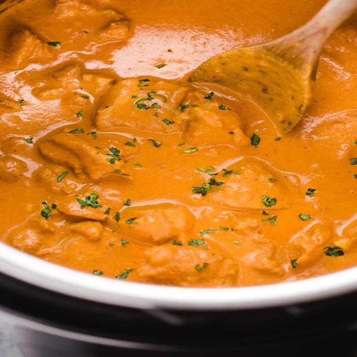 Indian butter chicken cooking with lots of sauce in an Instant Pot.