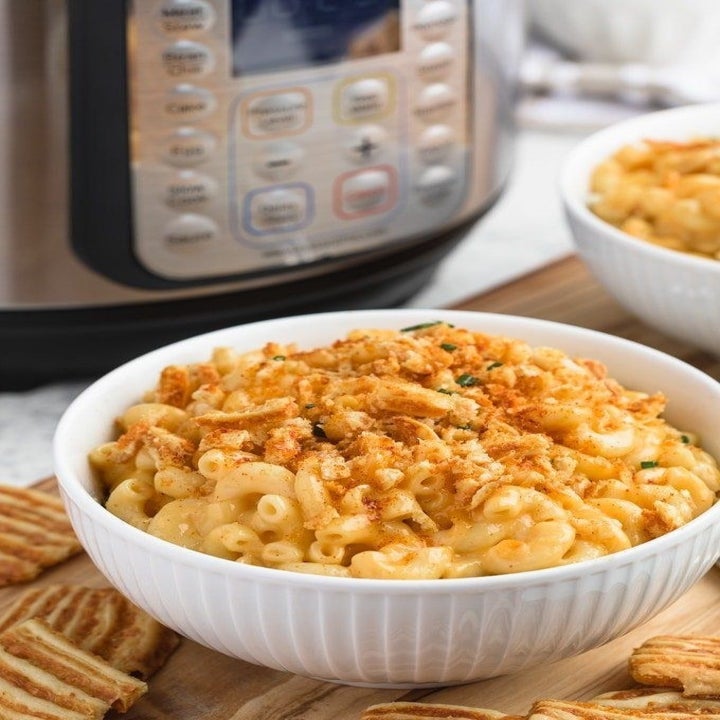 A bowl of creamy mac 'n' cheese with crispy topping.