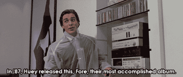 GIF of Christian Bale explaining the finer points of Huey Lewis and The News in American Psycho