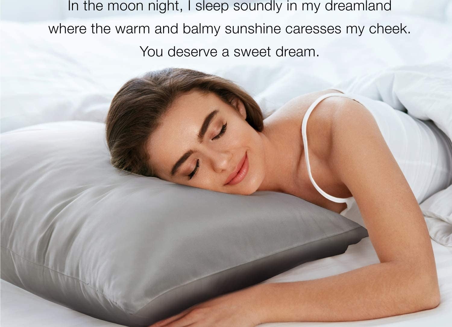 A model sleeping on a grey satin pillowcase