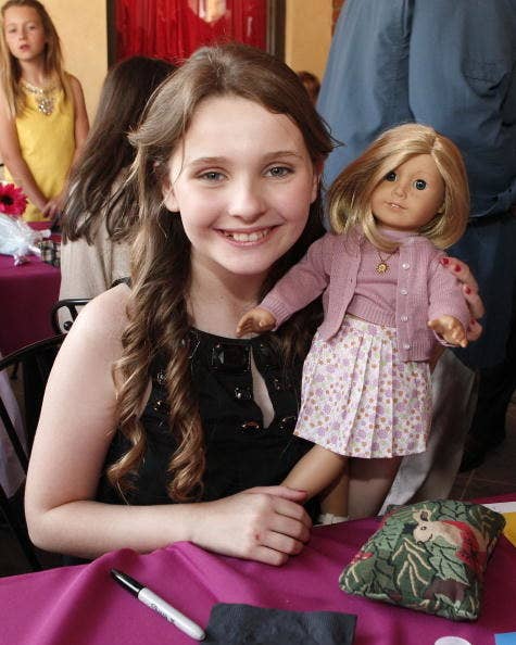 young Abigail Breslin with a Kit doll