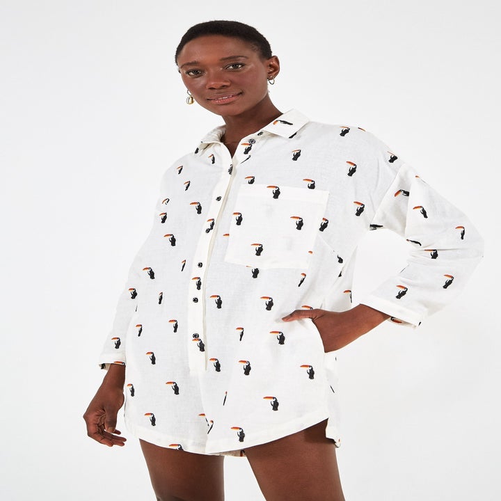 Model wearing the toucan embroidered romper