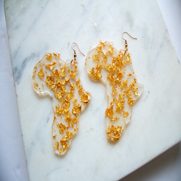 Clear acrylic and gold flake Africa-shaped statement earrings