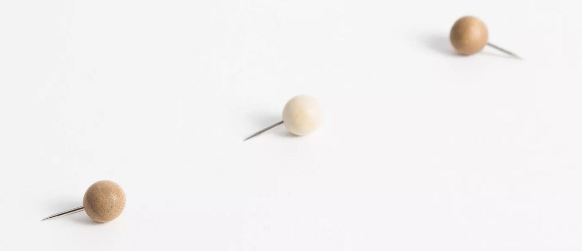Sphere wooden tacks in camel and ivory colors 