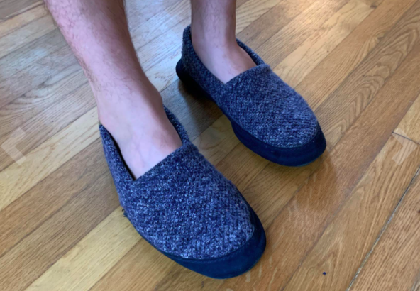 Reviewer photo showing person wearing the Acorn Men&#x27;s slippers in navy tweed