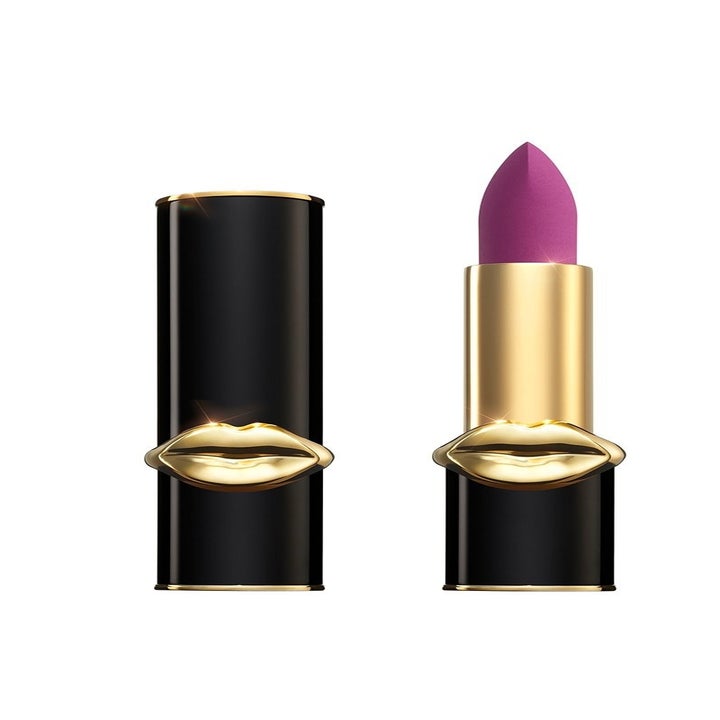 Pinkish violet lipstick in a black and gold tube with sculpted lips on it