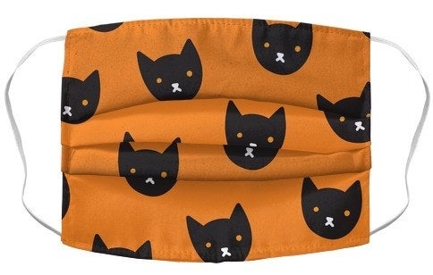 orange mask with cartoon black cat faces