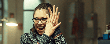 Cosima rubbing her hands together and giving a high five on Orphan Black