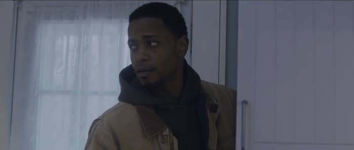 LaKeith standing in an open doorway. 