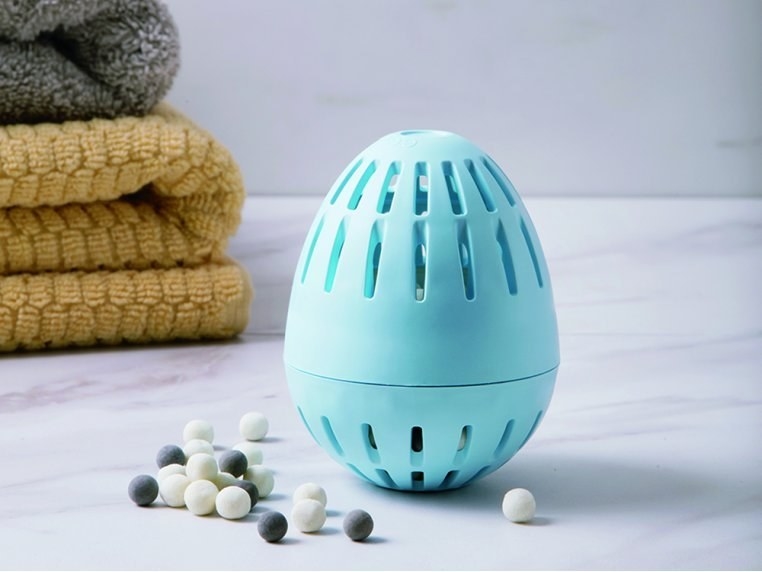 the mineral laundry egg with mineral beads next to it to show what is inside