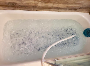 Same reviewer's tub with mat turned on, showing the large amount of bubbles that come up from the air pads