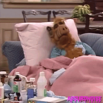 A gif of the TV character ALF being sick.