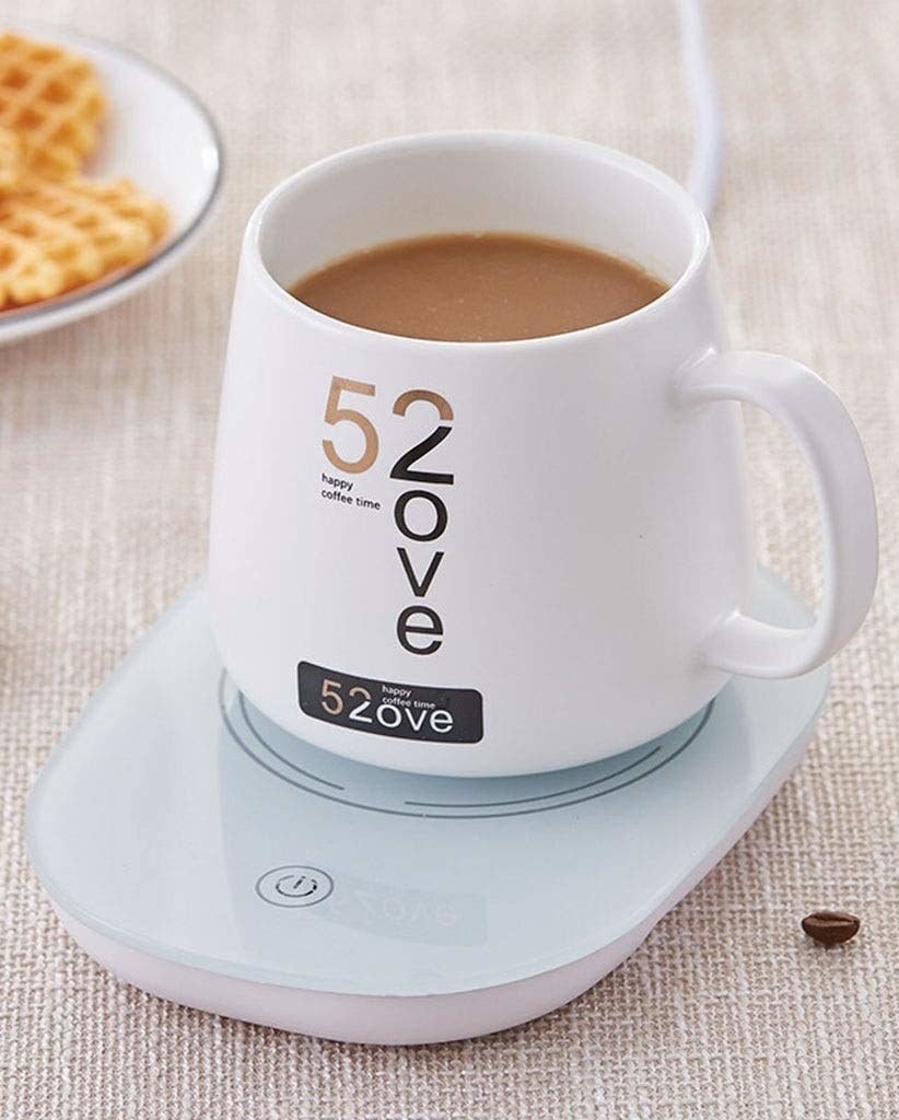 A mug filled with hot tea kept on the warmer