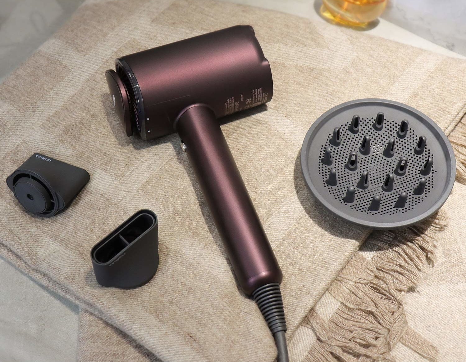 the purple metallic dryer with a black diffuser and two attachments