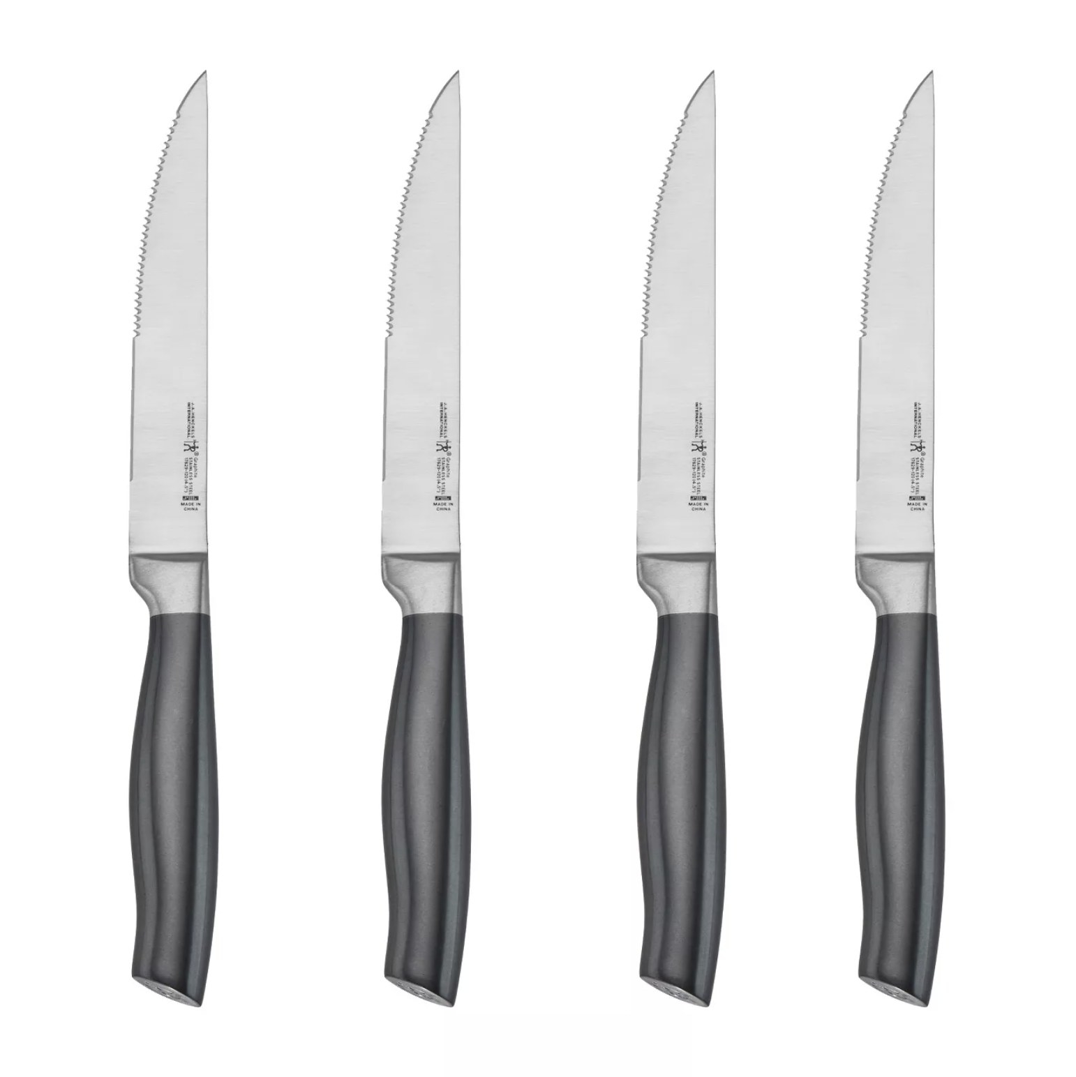 A set of four steak knives with black handles