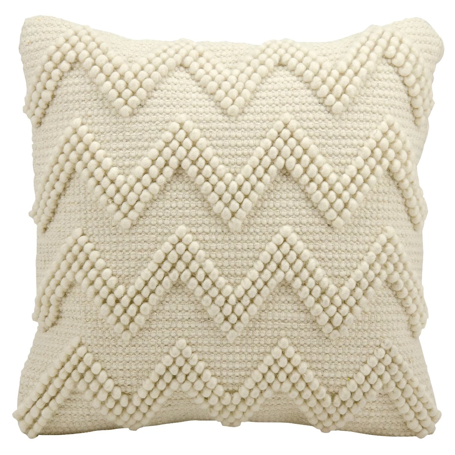 A cream throw pillow with a textured chevron design