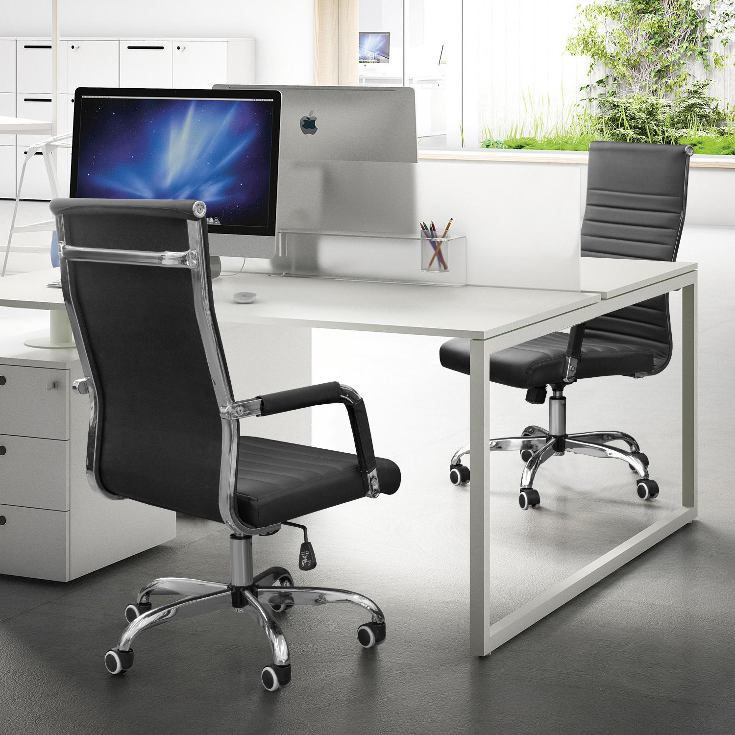 two black rolling office chairs in an office space