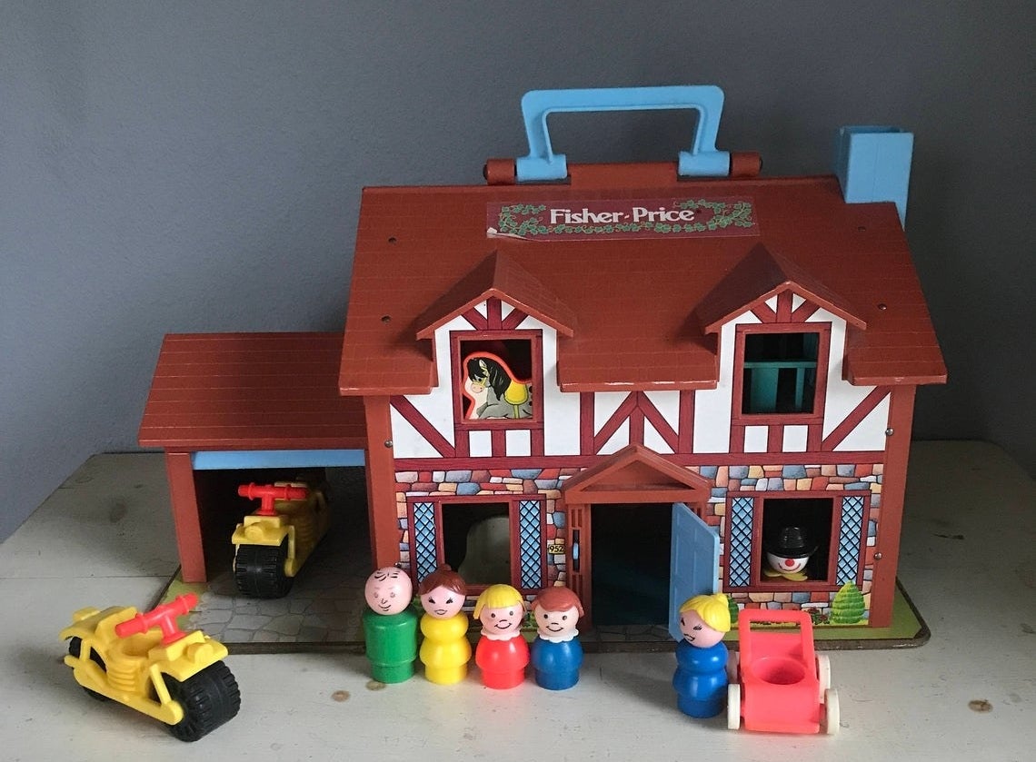 A Tudor style Fisher-Price Little People Family Playhouse