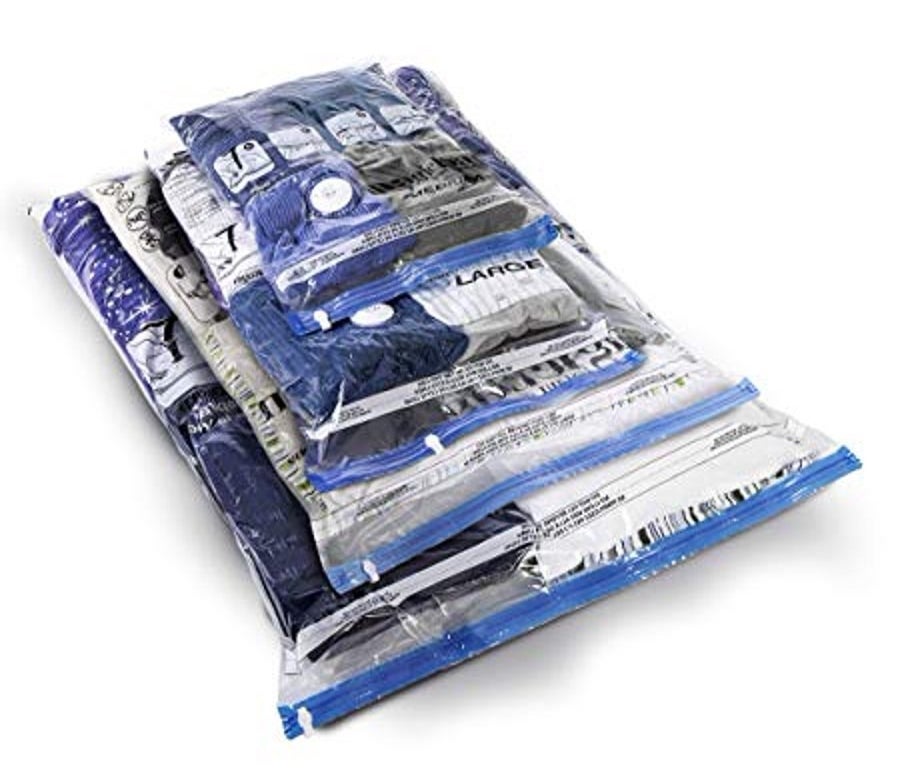 Three space saver storage bags with blue zippers