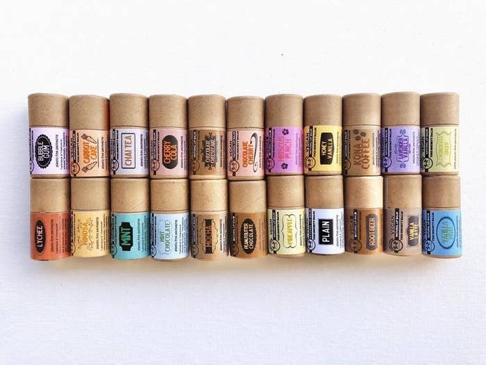 22 of the eco-friendly lip balms stacked on top of each other in two rows