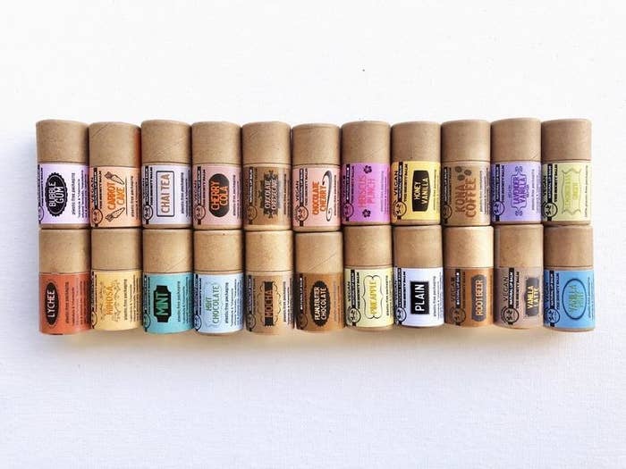 22 of the eco-friendly lip balms stacked on top of each other in two rows
