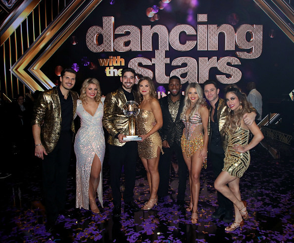 last year&#x27;s cast of DWTS with Hannah Brown holding the Mirrorball