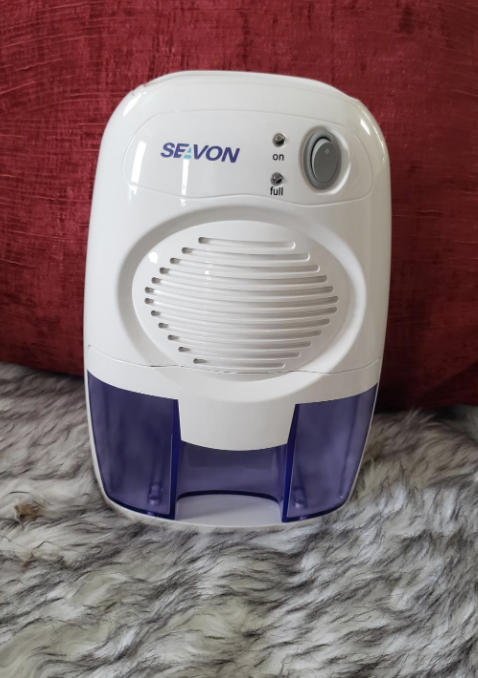 a reviewer&#x27;s photo of the small dehumidifier