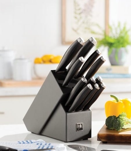 The knife set in their knife block 