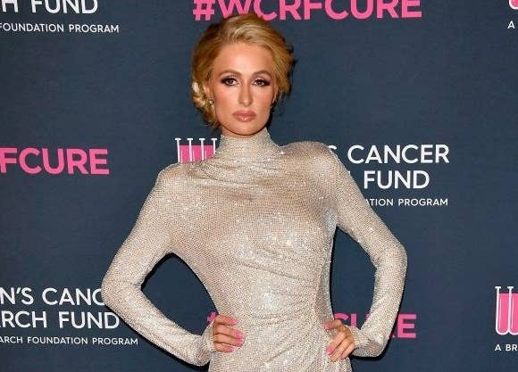 Paris Hilton wears a long, turtleneck gown to a Hollywood event