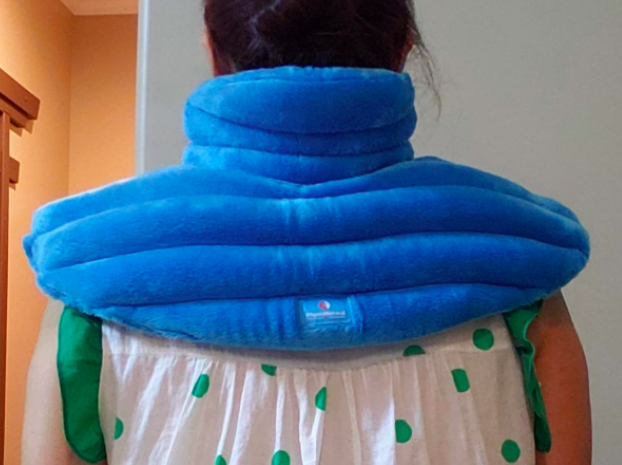 A reviewer wearing the blue plush wrap